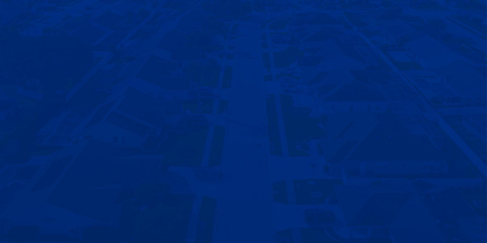 Aerial view of homes with blue overlay